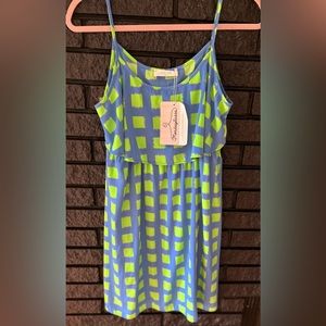 Peach Love boutique dress size Medium. New with tags. Spaghetti straps.